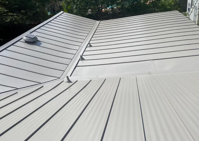 Solar attic fan installed on a metal roof for Roof Ventilation in Tamiami